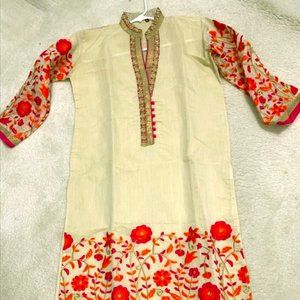 White tunic with decorative floral embroidery